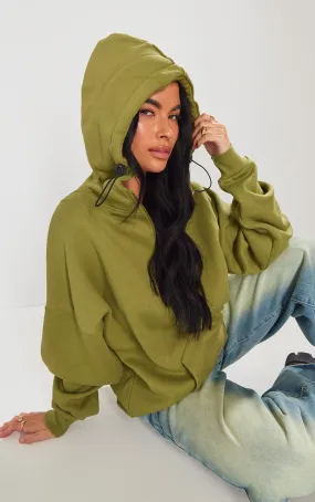 Hoodie vert olive à demi-zip et coutures apparentes