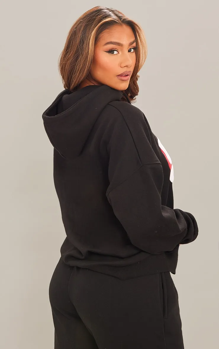 PRETTYLITTLETHING Hoodie noir oversize à slogan en relief